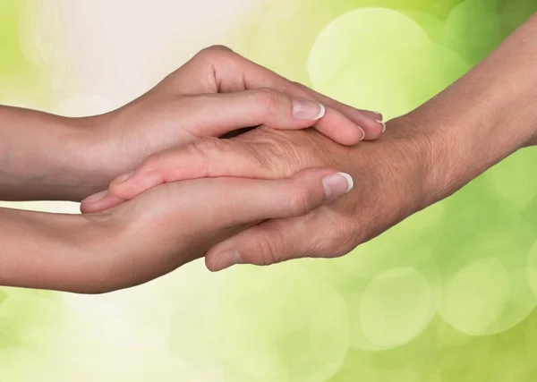 Hands of  old man and a young woman — Stock Photo, Image