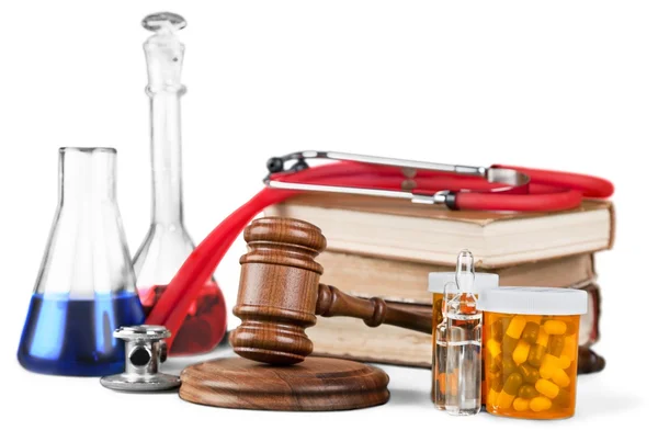 Gavel and medical supplies on white — Stock Photo, Image