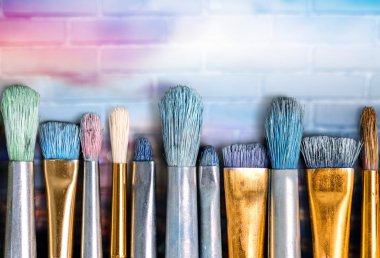 Row of artist paint brushes clipart