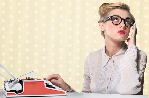 Woman working on vintage typewriter — Stock Photo, Image