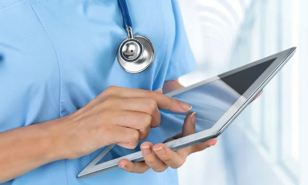 Doctor working with tablet pc — Stock Photo, Image