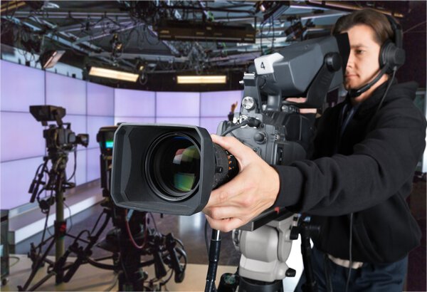 Cameraman working with camera  