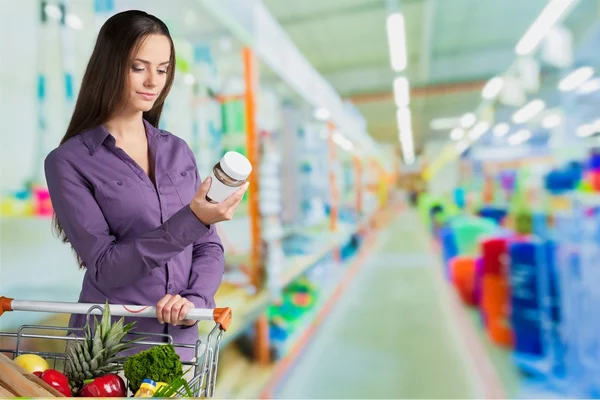 Woman with cart shopping — Stock Photo, Image