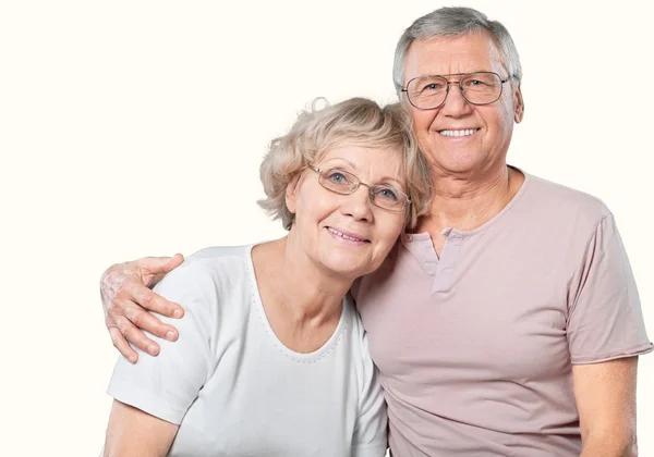 Щаслива старша пара посміхається вдома — стокове фото