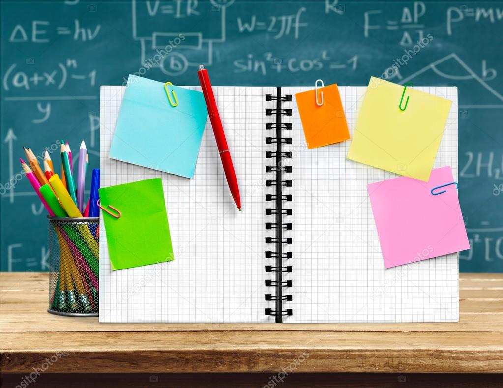 open blank notepad and school stationery