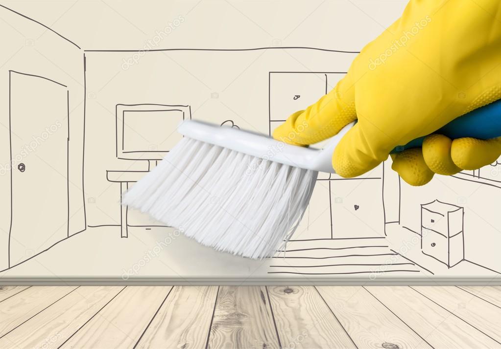 Yellow cleaning glove with a brush