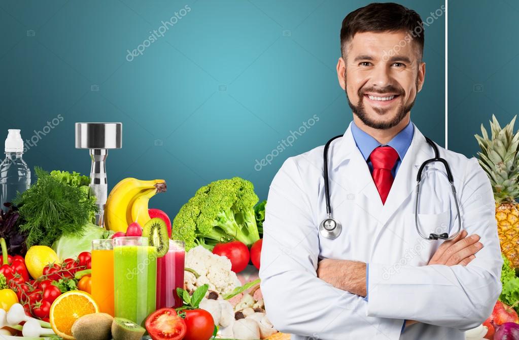 handsome doctor standing with arms crossed