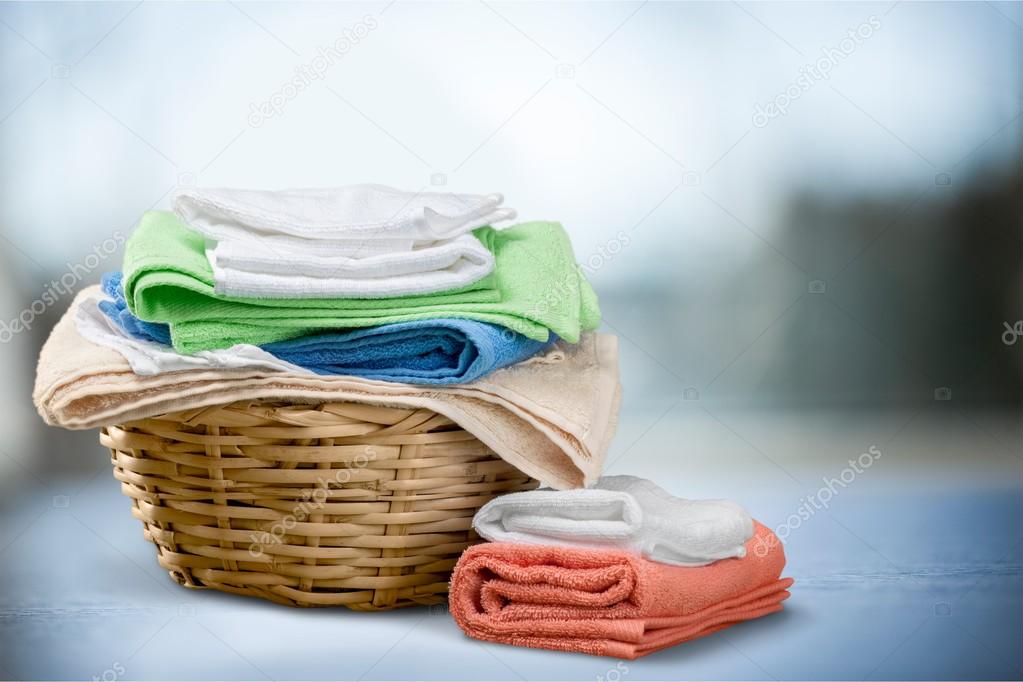 Laundry Basket with colorful towels Stock Photo by ©billiondigital