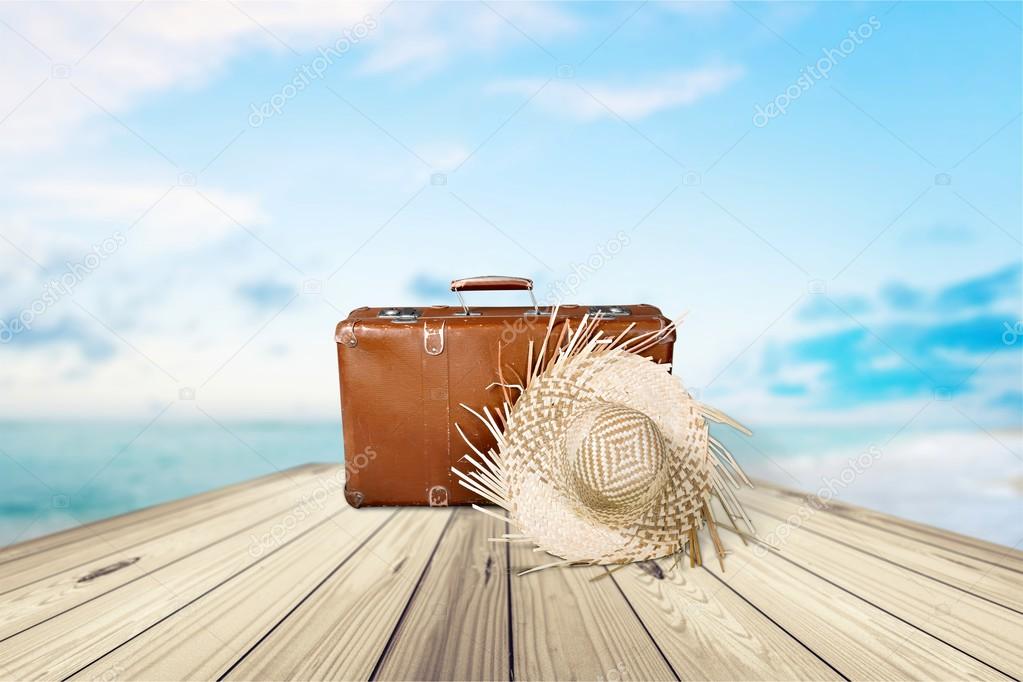 retro suitcase with travel hat