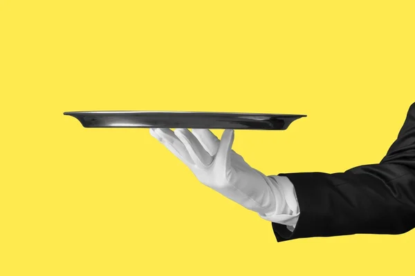 Waiter hand  holding an empty plate — Stock Photo, Image