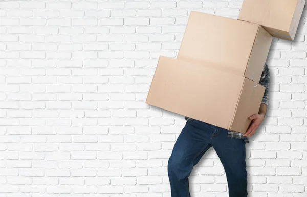 Lots of cardboard boxes and man — Stock Photo, Image