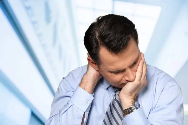 Middle aged businessman with headache — Stock Photo, Image