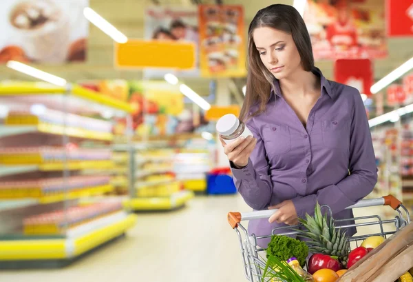 Woman with cart shopping — Stock Photo, Image