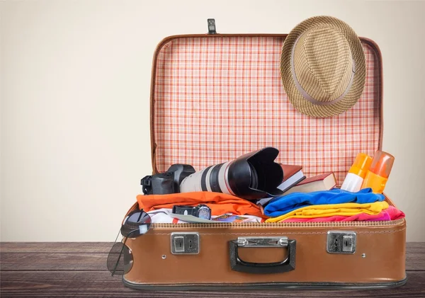 Retro suitcase with travel objects — Stock Photo, Image