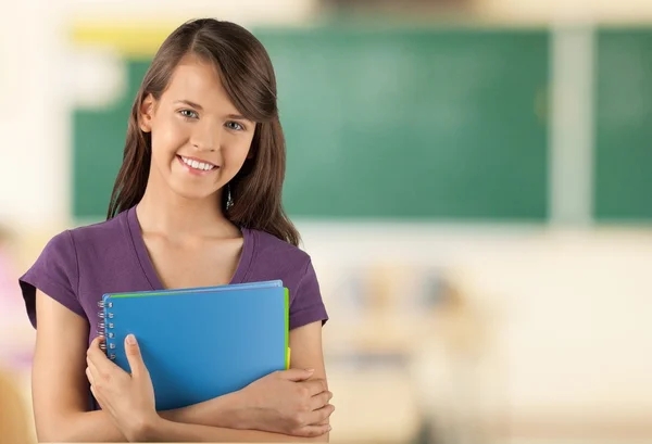 Young student girl holding book — Stock Photo, Image