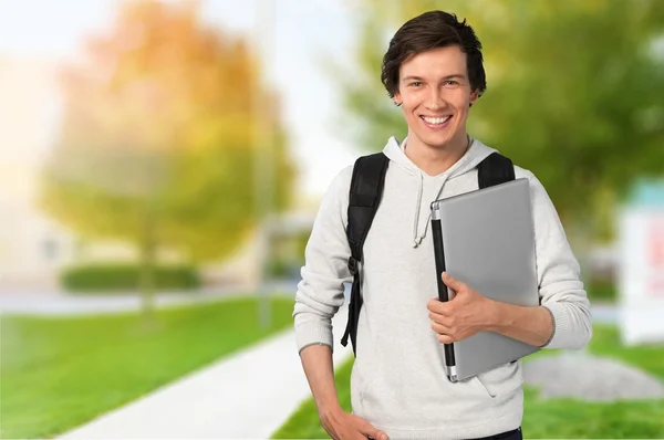 Männlicher Student mit Rucksack — Stockfoto