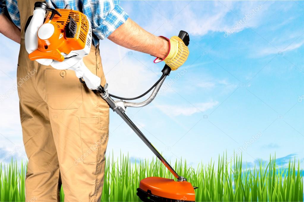 Close up of Man with lawn mower