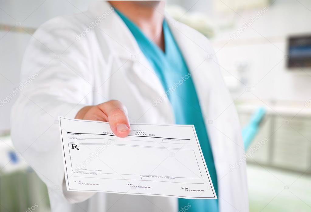 doctor hand  giving prescription to patient 