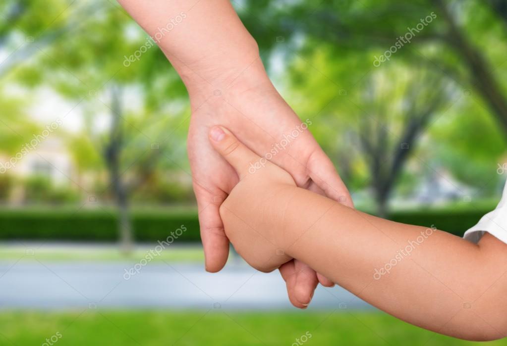 Father holding baby hand — Stock Photo © billiondigital 118622962