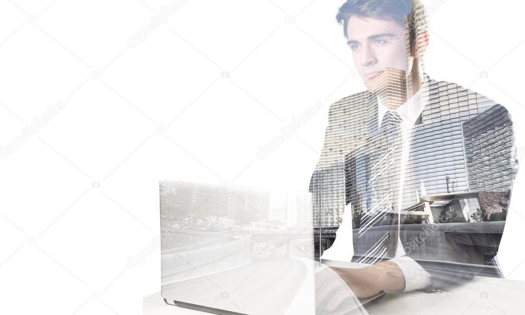 Portrait of happy businessman with laptop