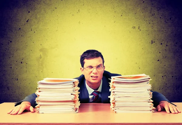 Young businessman with stack of papers — Stock Photo, Image