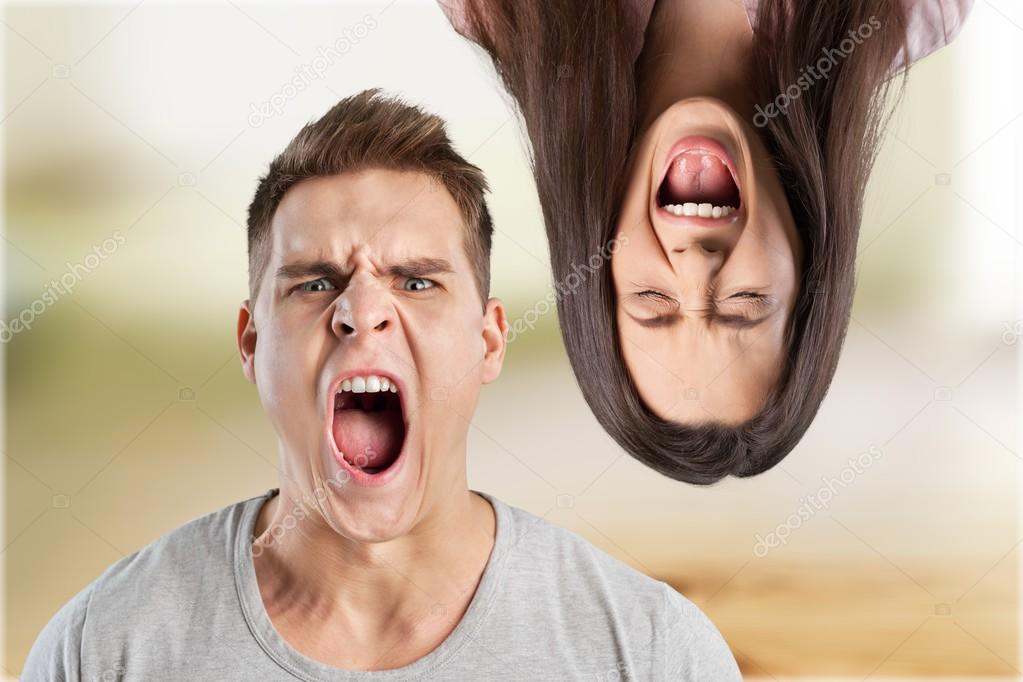 Angry young couple shouting