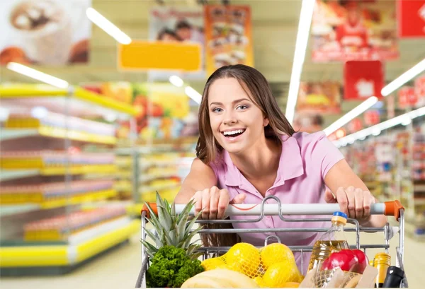 Woman with cart shopping — Stock Photo, Image