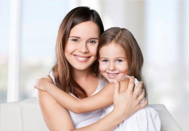 Mother and daughter hugging   clipart