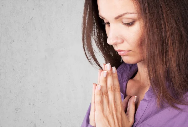 Portrait of a young woman praying — Stock Photo, Image