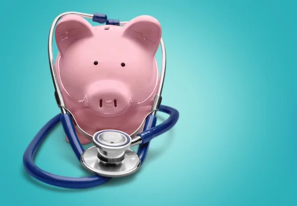 Piggy bank with stethoscope — Stock Photo, Image