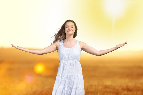 woman on field under sunset light