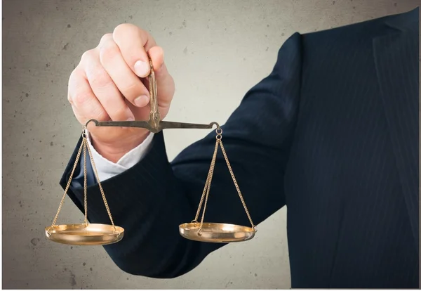 Businessman holding Scales — Stock Photo, Image