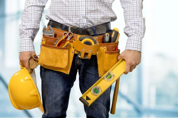 Worker with a tool belt — Stock Photo, Image