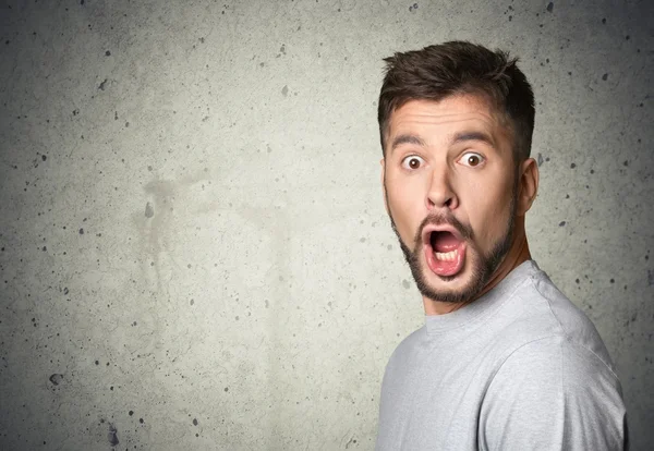 Gesichtsausdruck eines gutaussehenden Mannes — Stockfoto