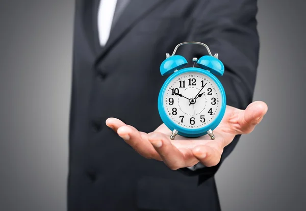 Businessman with clock in time concept — Stock Photo, Image