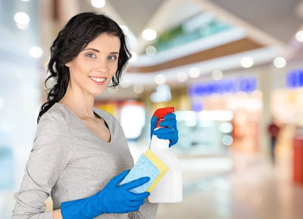 Woman holding cleaner and cloth — Stock Photo, Image