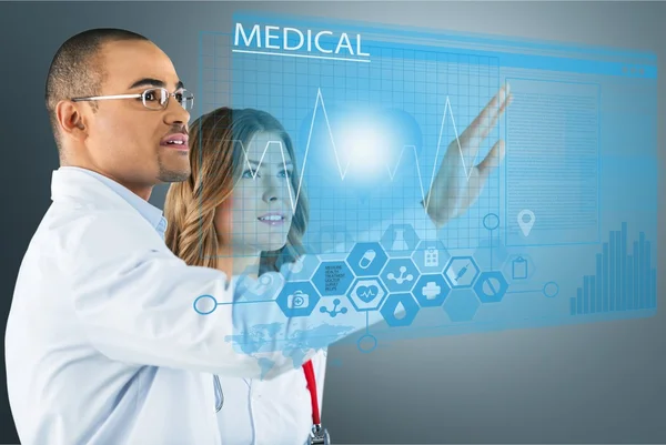 Doctors with modern computer interface — Stock Photo, Image