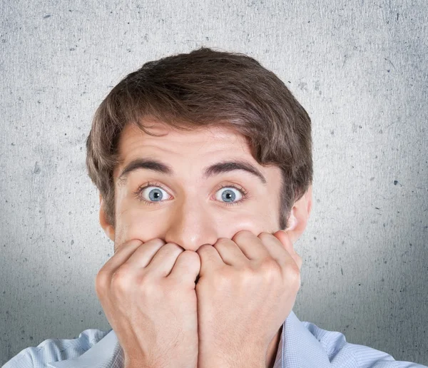 Scared young man with facial expression — Stock Photo, Image
