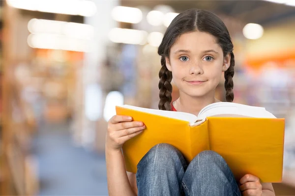 little student girl with  book