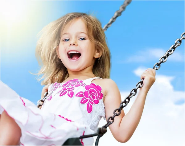 Little girl having fun on swing — Stock Photo, Image