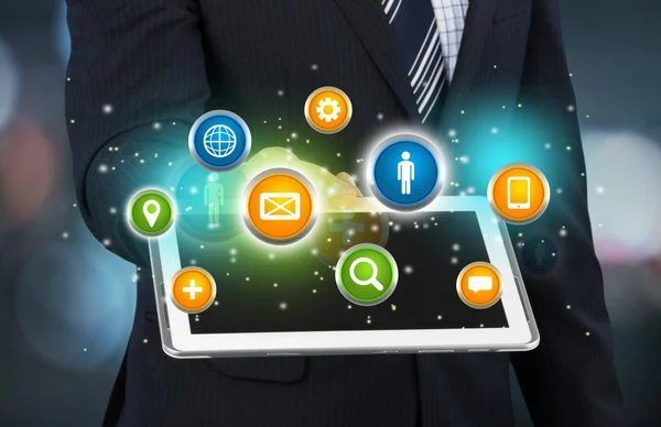 Businessman and tablet pc  with icons — Stock Photo, Image