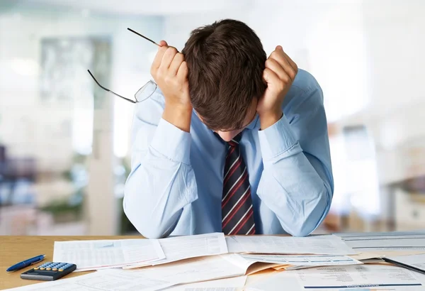 Businessman with many business papers — Stock Photo, Image