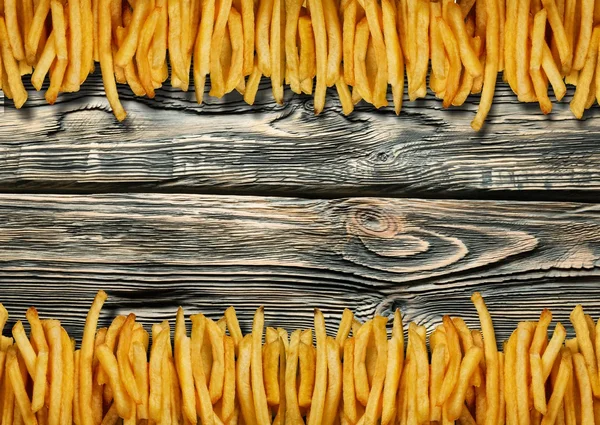 Pilha de batatas fritas apetitosas — Fotografia de Stock