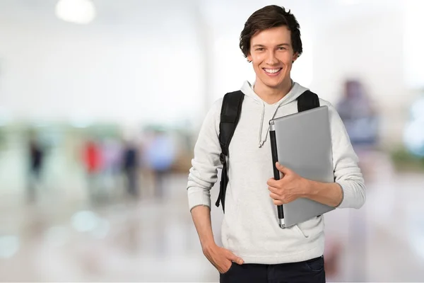 Estudante masculino com laptop — Fotografia de Stock