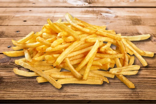 Pilha de batatas fritas apetitosas — Fotografia de Stock