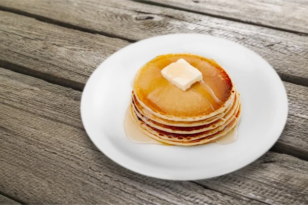 Stack of Small pancakes in syrup — Stock Photo, Image