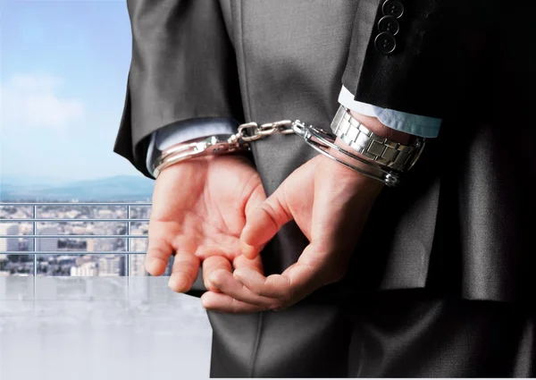 Man in handcuffs behind his back — Stock Photo, Image