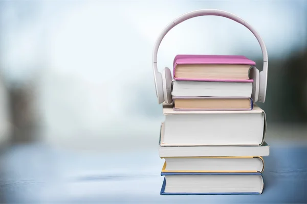 Books and headphones on background — Stock Photo, Image