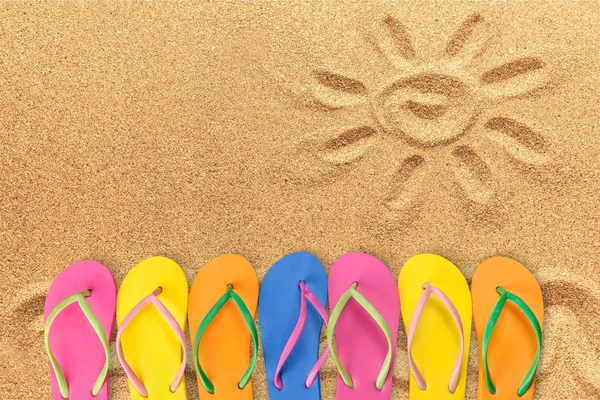 depositphotos_118719502-stock-photo-pairs-of-flip-flops-in
