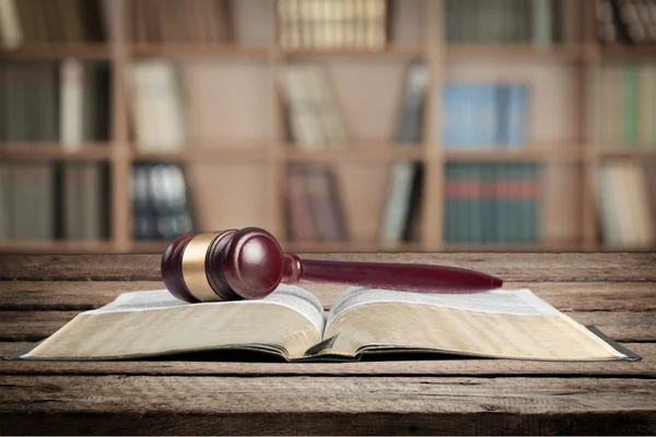 Book and wooden gavel on table — Stock Photo, Image